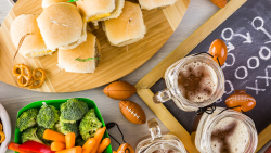 image with food, drinks and decorative small footballs